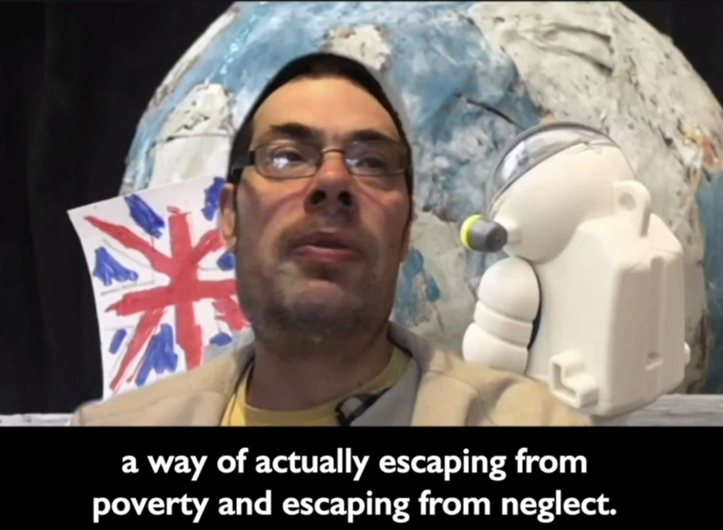 Still from video of Christopher Burns talking about his experience of housing, disability and poverty